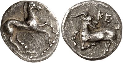 a silver coin with an image of a horse and a bird on it