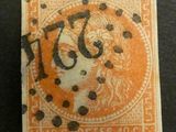 un timbre orange et noir sur lequel figure l'image d'une femme
