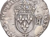 a close up of a coin with a crown on top of it