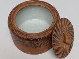 an image of a wooden container with a lid on a white surface