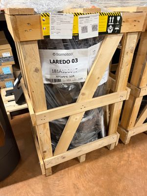 two pallets of wood are stacked on top of each other in a warehouse