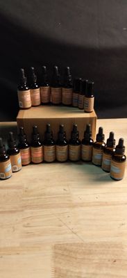 a wooden table topped with bottles of essential oils on top of it
