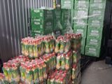 boxes of fruit are stacked on a pallet in a warehouse