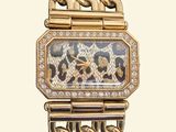a gold watch with a leopard pattern on the face