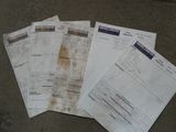 several papers sitting on the ground next to each other on top of a table