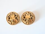 pair of vintage gold tone earrings with filigree design