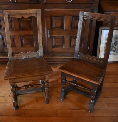 three wooden chairs sitting next to each other on a wooden floor