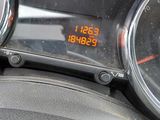 a digital clock on the dashboard of a car
