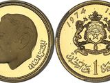 a close up of a gold coin with an image of a man ' s face