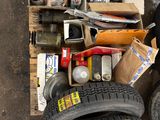 a pile of assorted tires and other items on the ground