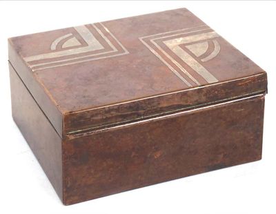a wooden box that has a design on it