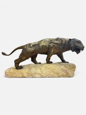 statue of a lion on a rock on a white background