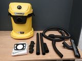 a yellow blow dryer sitting on top of a wooden table