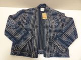 an image of a blue and white jacket with a tag on it