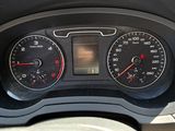 a close up of a car dashboard with various gauges