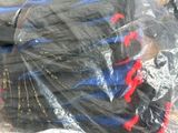 a pile of clothes wrapped in plastic on a pallet