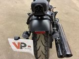 a motorcycle that is parked on the side of the road