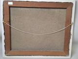 an old picture frame with a rope hanging from it ' s side