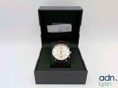 an image of a watch in a box on a white background