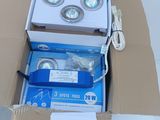 a box with three lights inside of it on a table