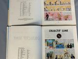 two open books on a table with pictures on them