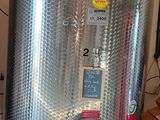 a stainless steel tank that is sitting in a garage