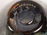 a close up of a glass vase with writing on it
