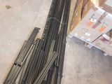 a pile of steel rods sitting on the floor in a warehouse