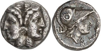 a silver coin with a woman and a man on it
