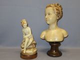a statue of a boy and a bust of a boy