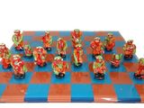 many figurines of people on a chess board