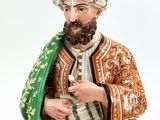 an image of a figurine of a man with a beard and a turban