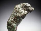 an image of a sculpture of a dog on a white surface