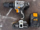 a cordless drill and two batteries on the floor