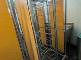a room that has a bunch of metal racks in it
