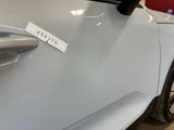 a sticker on the door handle of a car