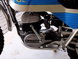 a close up of a motorcycle parked in a garage
