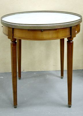 a small table with a mirror on top of it
