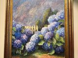 a painting hanging on the wall of a room