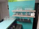 many empty glasses on the shelves in the room
