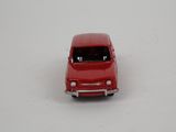 a red toy car that is sitting on a white surface