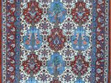 a red and blue rug with a floral design