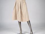 mannequin dressed in a beige skirt and black top