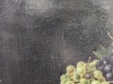 a painting of a bunch of grapes on a window sill