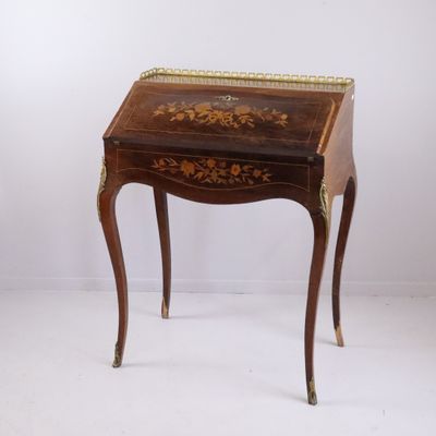 a small wooden table with a drawer on top of it