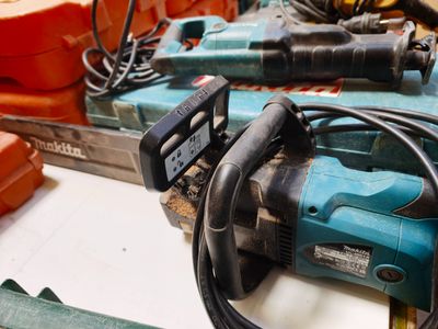 many tools that are on a table with orange boxes