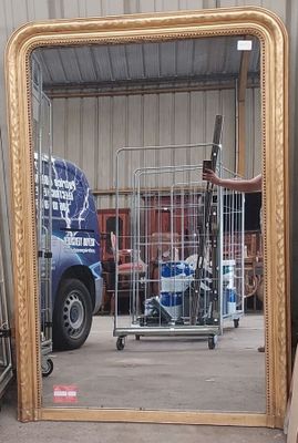 a large mirror that is sitting on the floor