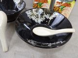 two bowls and a spoon sitting on a table