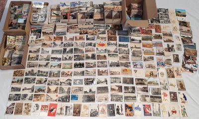 a lot of old postcards on the table