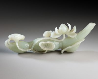 a white vase with a dragon on it sitting on a table